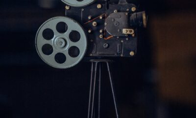 A classic vintage film camera on a tripod, capturing nostalgic cinematic equipment.