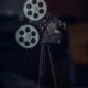A classic vintage film camera on a tripod, capturing nostalgic cinematic equipment.