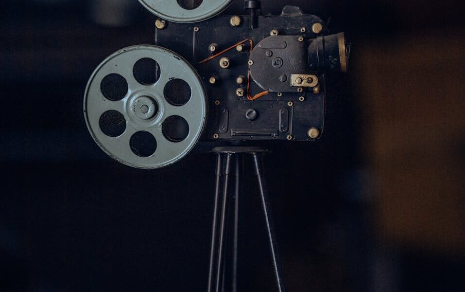 A classic vintage film camera on a tripod, capturing nostalgic cinematic equipment.