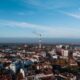 A stunning aerial view of Belgrade, Serbia featuring urban architecture and a prominent smoke stack.