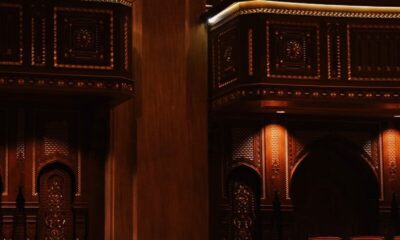 Intricate wooden detailing inside the Royal Opera House Muscat with plush seating