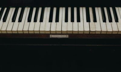A close-up view of vintage piano keys showcasing the wear and character of the instrument.