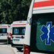 Three ambulances parked outdoors, ready for emergency healthcare situations.