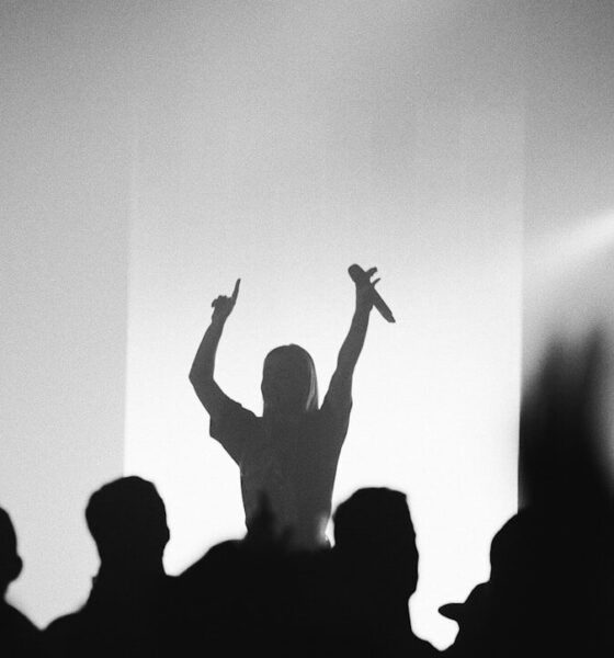 man holding microphone at the stage