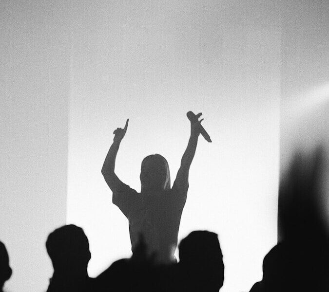 man holding microphone at the stage